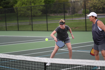 pickleball doubles return during a women's match