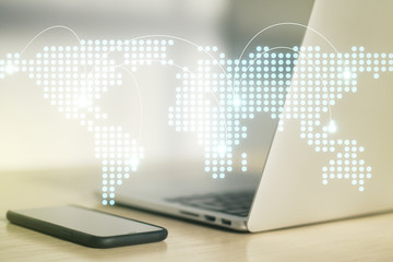 Abstract creative world map with connections on modern laptop background, international trading concept. Multiexposure