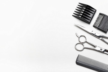 A set of tools for hairdresser on white background, top view, copy space