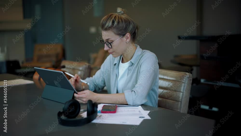 Poster intelligent woman in optical spectacles creating financial graph during accounting time with data in