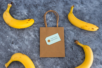 home delivery of groceries, bananas with grocery shopping bag among them