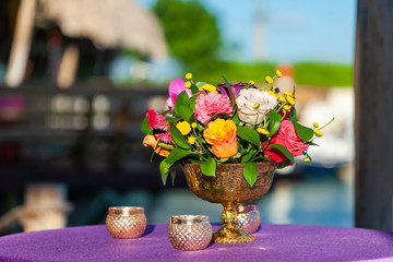 Bridal flowers bouquet on the sandy beach as decoration for tropical destination wedding ceremony