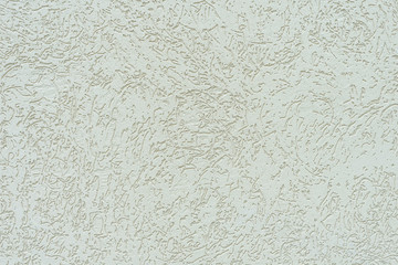 Plaster of the house with the texture of eaten bark bark