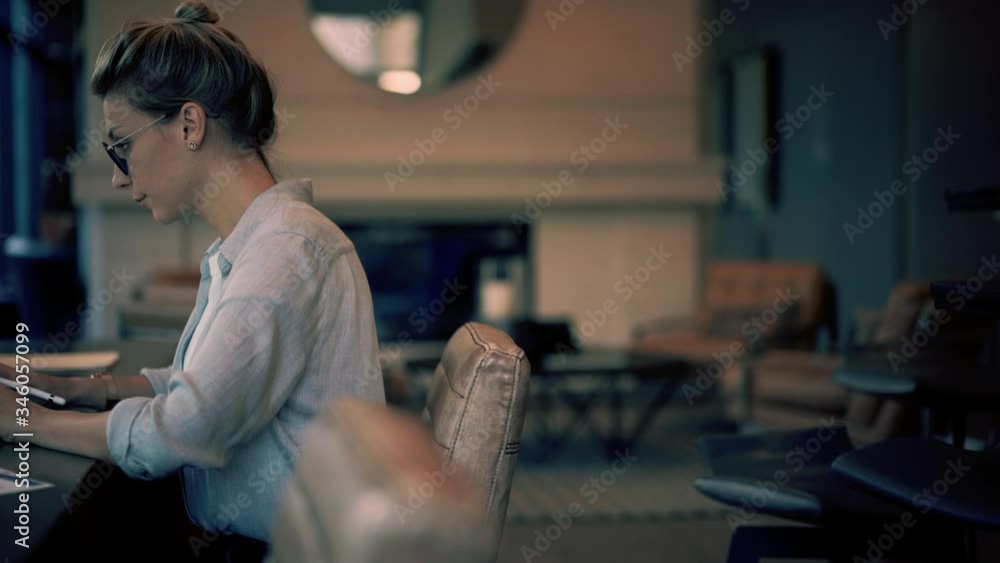 Poster intelligent woman sitting at desktop with digital tablet for browsing websites and using 4g wireless