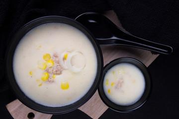Chicken Corn Soup in a black bowl