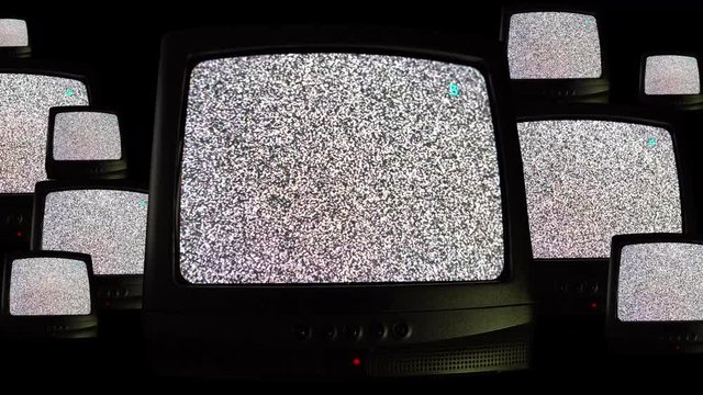 Fantastic repeating pattern of multiplied retro televisions on green screen with noise static, many televisions inside another TV, blinking screens and flickers. Moving televisions with static and
