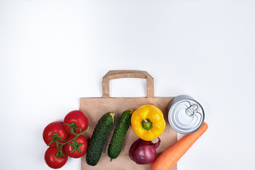 Food for quarantine. Fruits, vegetables, canned food, cereal swells with a paper bag. Copyspace. On...
