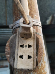 Old electrical outlet On a rusty pole