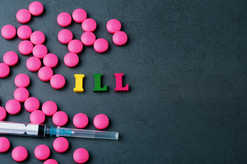 An inscription ill on a gray background surrounded by scattered tablets and a syringe.