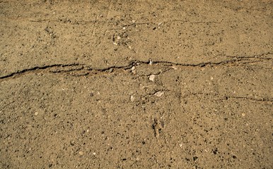 Fototapeta na wymiar Crack in the pavement. Background for design.