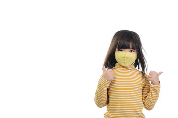Protection Coronavirus and Air pollution pm2.5 concept. A little asian girl of 6 years old wearing...