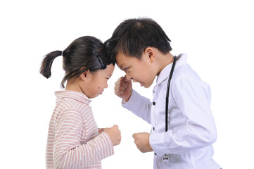 Facial expressions and emotional gestures of children concept. Two little asian children (boy and girl) doing gestures and expressing very angry faces and shouted at each other with a punch on isolate