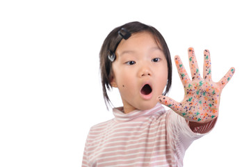 Children health care for germs and touch concepts. A cute asian girl of 7 years old shocking by bacteria on hands. Kid showing hand with emotion face and The gestures raised a hand. (selective focus)