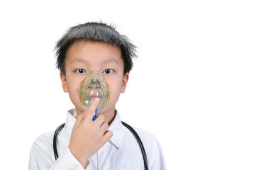 A good looking Asian boy wearing white shirt using a respirator mark to treat and alleviate the symptoms caused by the respiratory system on isolate of white backgrounds.