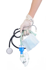 Protection Coronavirus and Air pollution pm2.5 concept. Close up hand of doctor holding a self-protect mask, stethoscope, respiratory mask for preventing air pollution and viruses on isolate of white.