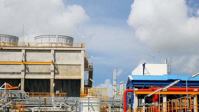 Cooling tower area in industrial plant, Panning video