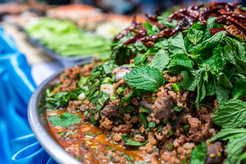 Spicy Thai Food , Spicy minced pork in a container placed on the table