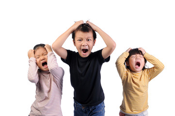 Cumulative stress condition concept. Facial expressions and emotional gestures of children in high stress conditions. Three asian kids boy and girls raise hands holding to head and sad of emotion face