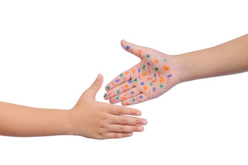 Baby health care for germs and touch concepts. Close-up hands of two little kids shaking hands and one of the child have many bacteria on hand that is ready to spread the disease to others.