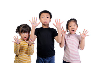 Children health care for germs and touch concepts. Three little Asian boy and girls shocking by bacteria on hands. 3 Kids doing gestures and expressing very shocked and raise hands to hold near face.