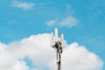 wifi hotspot pole with blue green sky and clouds
