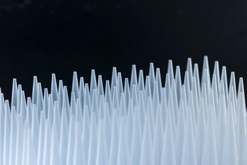 plastic tips for dispensers. Macro of some pipette plastic tips in a rack.