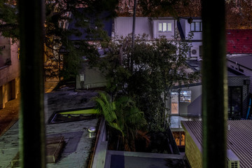 Fototapeta na wymiar mysterious light overlooking inner city backyards