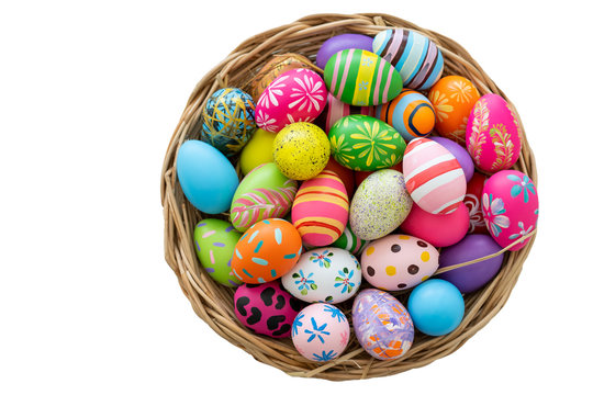 Isolated with clipping path. Photograph of colorful eggs in basket for Easter egg festival. 