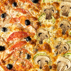 pizza close-up. background pizza with mushrooms and tomatoes