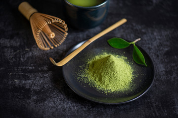 Japanese matcha tea  in bowl on black background