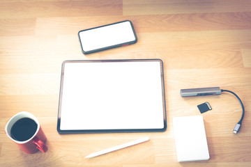 Tablets, mobile phones and coffee cups for work at home