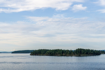 Haro strait view from Vancouver island with cloudy sky British Columbia Canada.