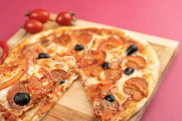 pizza close-up, isolated, against a colored background. whole pizza 