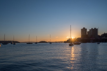 yachts on the water at sunrise