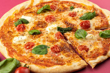 pizza close-up, isolated, against a colored background. whole pizza 