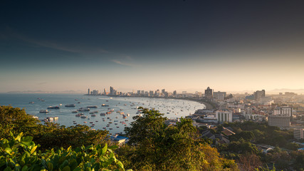 Fototapeta premium View of Pattaya city beach during sunrise at Pratumnak Viewpoint, Pattaya Thailand.