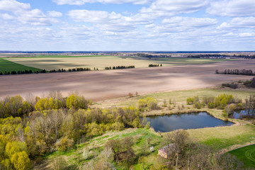 plowed fields in countryside. rural landscape on a bright sunny day. aerial view