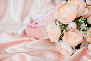 Pink composition with flowers and gift box