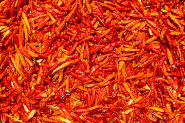 close up shot of a a pile of red hot chilli