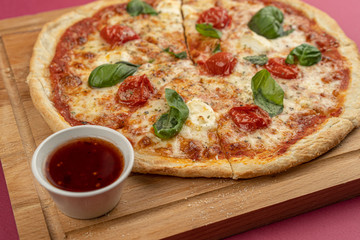pizza close-up, isolated, against a colored background. whole pizza 