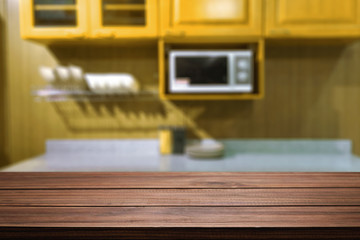 Wood desk space and blurred of kitchen background. for product display montage. business presentation.