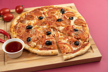 pizza close-up, isolated, against a colored background. whole pizza 