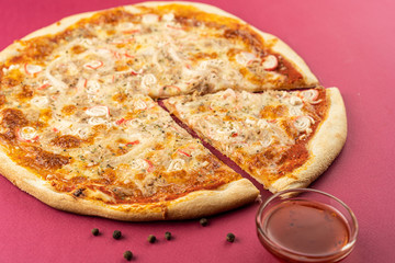 pizza close-up, isolated, against a colored background. whole pizza 
