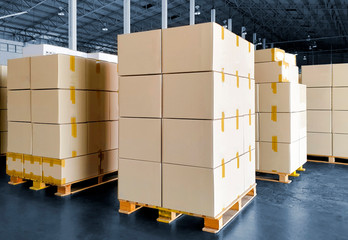 Packaging Boxes Stacked on Pallets in Storage Warehouse. Cartons Cardboard Boxes. Supply Chain....