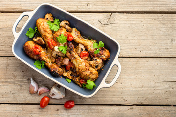 Baked chicken legs with vegetables