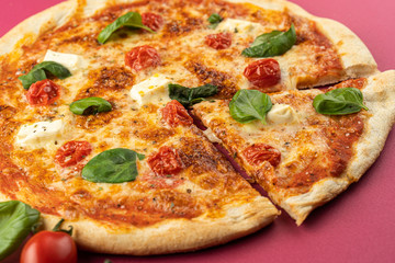 pizza close-up, isolated, against a colored background. whole pizza 