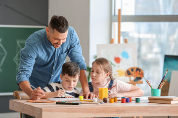 Drawing teacher giving optional classes at school