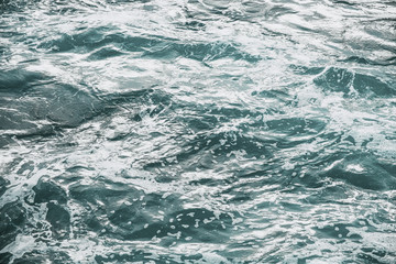 Seething surface of sea water shot in the open sea directly from above
