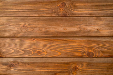 Fototapeta premium The texture of the wooden background consisting of boards painted in the color of wenge, designed for photographs.