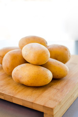 close up potatoes on kitchen table